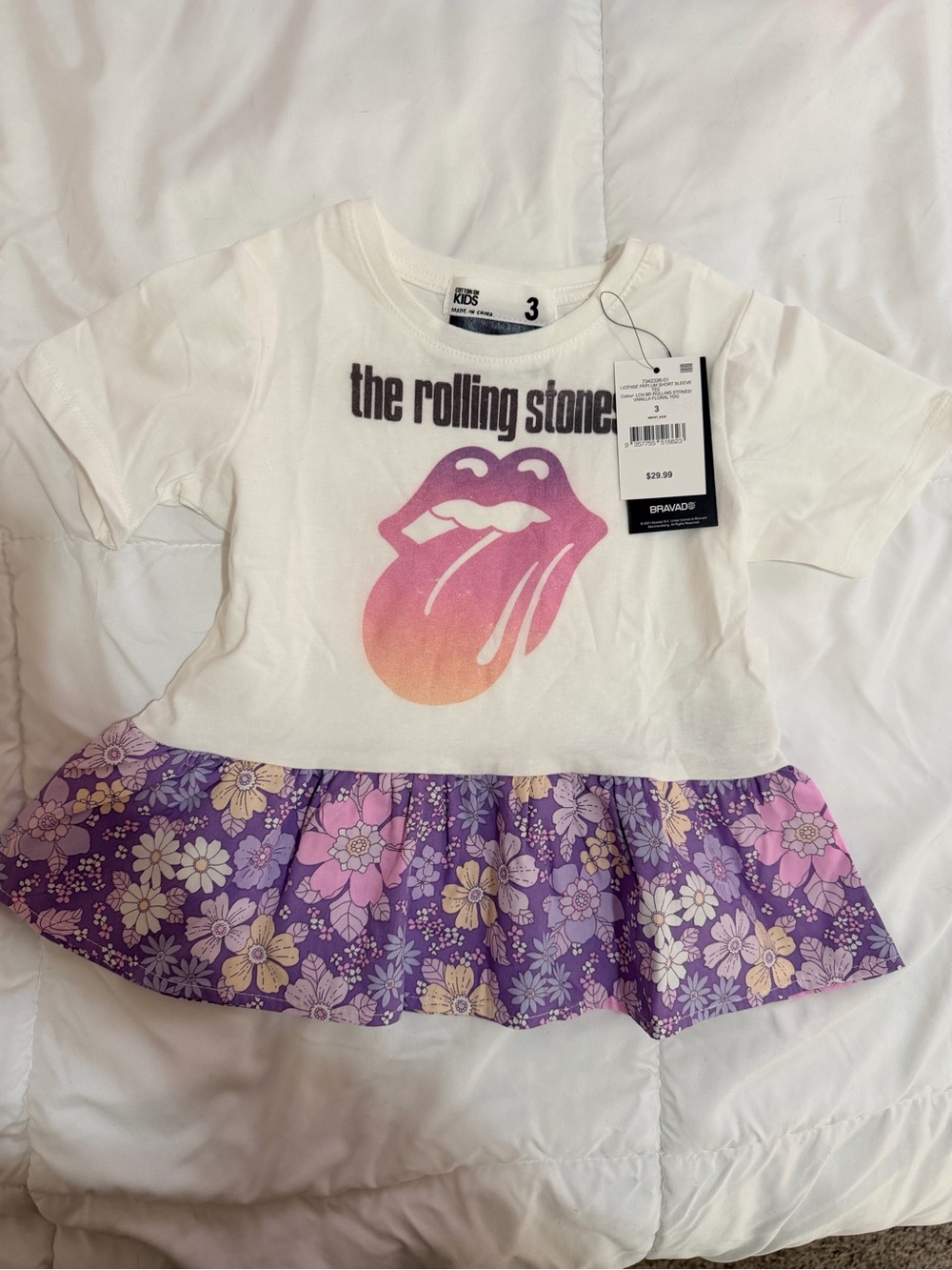 Cotton On White Tee with Pink-to-Orange Gradient Logo and Purple Floral Skirt